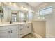 Elegant bathroom with double vanity, quartz countertop and a large shower at 221 Brindisi Cir, Nokomis, FL 34275