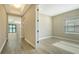 Hallway view showing access to a bedroom and living room area at 221 Brindisi Cir, Nokomis, FL 34275