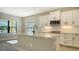 Modern kitchen with white cabinets and quartz countertops at 221 Brindisi Cir, Nokomis, FL 34275