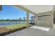 Covered patio overlooking a lake, perfect for outdoor relaxation at 221 Brindisi Cir, Nokomis, FL 34275