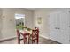 Charming breakfast nook with wood table and chairs, adjacent to pantry at 3015 Brockton St, North Port, FL 34286