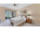 Comfortable main bedroom with sliding glass doors leading to a private patio at 3339 Highlands Bridge Rd # 65, Sarasota, FL 34235