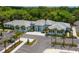 Aerial view of a modern community clubhouse with ample parking at 3339 Highlands Bridge Rd # 65, Sarasota, FL 34235