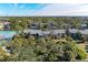 Aerial view of condo community with tennis courts at 360 Pine Run Dr, Osprey, FL 34229