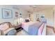 Charming bedroom with pink bedding, gray accents, and a ceiling fan at 360 Pine Run Dr, Osprey, FL 34229