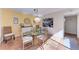 Bright dining room featuring a glass-top table and rattan chairs at 360 Pine Run Dr, Osprey, FL 34229