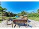 Community fire pit and seating area overlooking a canal at 360 Pine Run Dr, Osprey, FL 34229