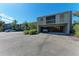 Condo building with carport parking and additional guest parking at 360 Pine Run Dr, Osprey, FL 34229