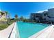 Community pool with lounge chairs and patio area at 360 Pine Run Dr, Osprey, FL 34229