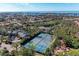 Aerial view of community tennis courts near the ocean at 360 Pine Run Dr, Osprey, FL 34229