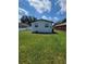 Large grassy backyard with a white fence at 3611 3Rd S Ave, St Petersburg, FL 33711