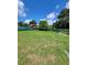 Large grassy backyard with a privacy fence and mature trees at 3611 3Rd S Ave, St Petersburg, FL 33711