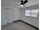 Bright bedroom with ceiling fan and grey vinyl flooring at 3611 3Rd S Ave, St Petersburg, FL 33711