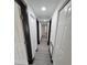 Bright hallway with grey wood-look flooring and black trim at 3611 3Rd S Ave, St Petersburg, FL 33711