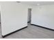 Bright hallway with grey wood-look flooring and black trim at 3611 3Rd S Ave, St Petersburg, FL 33711