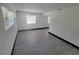 Bright living room with a window and grey vinyl flooring at 3611 3Rd S Ave, St Petersburg, FL 33711