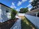 Landscaped side yard with stone walkway at 3611 3Rd S Ave, St Petersburg, FL 33711