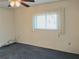 Well-lit bedroom with blue carpet and window at 3756 Lake Bayshore # 509, Bradenton, FL 34205