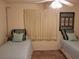 Two twin beds, light blue bedding, and cream curtains in a sunny bedroom at 3756 Lake Bayshore # 509, Bradenton, FL 34205