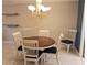 Charming dining room with round table and six chairs at 3756 Lake Bayshore # 509, Bradenton, FL 34205