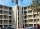 Condo building with palm trees and parking at 3756 Lake Bayshore # 509, Bradenton, FL 34205