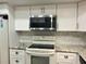 Updated kitchen with stainless steel appliances at 3756 Lake Bayshore # 509, Bradenton, FL 34205