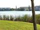 Scenic view of a lake with lush greenery and buildings at 3756 Lake Bayshore # 509, Bradenton, FL 34205