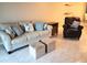 Bright living room with comfy seating and tiled floors at 3756 Lake Bayshore # 509, Bradenton, FL 34205