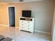 Living room with white dresser and TV at 3756 Lake Bayshore # 509, Bradenton, FL 34205