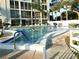 Community pool with multiple people swimming at 3756 Lake Bayshore # 509, Bradenton, FL 34205