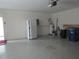 Garage with refrigerator, water heater, and extra storage at 376 Oak Hill Dr # 36, Sarasota, FL 34232