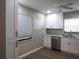 Modern white kitchen with stainless steel appliances at 376 Oak Hill Dr # 36, Sarasota, FL 34232