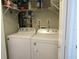 Laundry closet with washer and dryer, and shelving at 376 Oak Hill Dr # 36, Sarasota, FL 34232