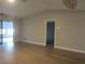 Living room featuring hardwood floors and sliding glass doors at 376 Oak Hill Dr # 36, Sarasota, FL 34232