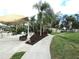 Community patio with seating, landscaping, and walkway at 376 Oak Hill Dr # 36, Sarasota, FL 34232