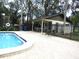 Community pool area with covered tables and restrooms at 376 Oak Hill Dr # 36, Sarasota, FL 34232