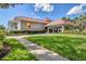 Bright and airy clubhouse with welcoming landscaping at 419 Yacht Harbor Dr, Osprey, FL 34229