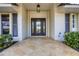 Inviting entryway with decorative glass door and stone flooring at 419 Yacht Harbor Dr, Osprey, FL 34229