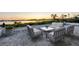 Elegant patio furniture on a brick patio overlooking the water at 419 Yacht Harbor Dr, Osprey, FL 34229