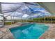 Inviting pool and spa with a covered patio, perfect for relaxation at 419 Yacht Harbor Dr, Osprey, FL 34229