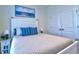 Guest bedroom with a white bed frame, nightstands, and built-in closet at 4337 Sunmill Ct, Lakewood Ranch, FL 34211