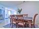 Charming dining room features a rustic table with beige chairs at 4337 Sunmill Ct, Lakewood Ranch, FL 34211