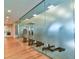 View down a hallway with frosted glass doors leading to a fitness center at 4337 Sunmill Ct, Lakewood Ranch, FL 34211