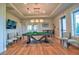 Game room with pool table and comfortable seating at 4337 Sunmill Ct, Lakewood Ranch, FL 34211