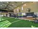 Large indoor turf area with basketball hoop and exercise equipment at 4337 Sunmill Ct, Lakewood Ranch, FL 34211