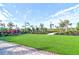 Landscaped lawn with artificial turf and seating at 4337 Sunmill Ct, Lakewood Ranch, FL 34211