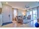 Bright living room with tile floors, comfy seating, and sliding glass doors at 4337 Sunmill Ct, Lakewood Ranch, FL 34211