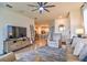 Open concept living room with a view into the kitchen and dining areas at 4337 Sunmill Ct, Lakewood Ranch, FL 34211