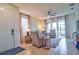 Living room with gray sectional sofa and access to backyard at 4337 Sunmill Ct, Lakewood Ranch, FL 34211