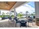 Outdoor patio area with seating and views of the pool and landscaping at 4337 Sunmill Ct, Lakewood Ranch, FL 34211